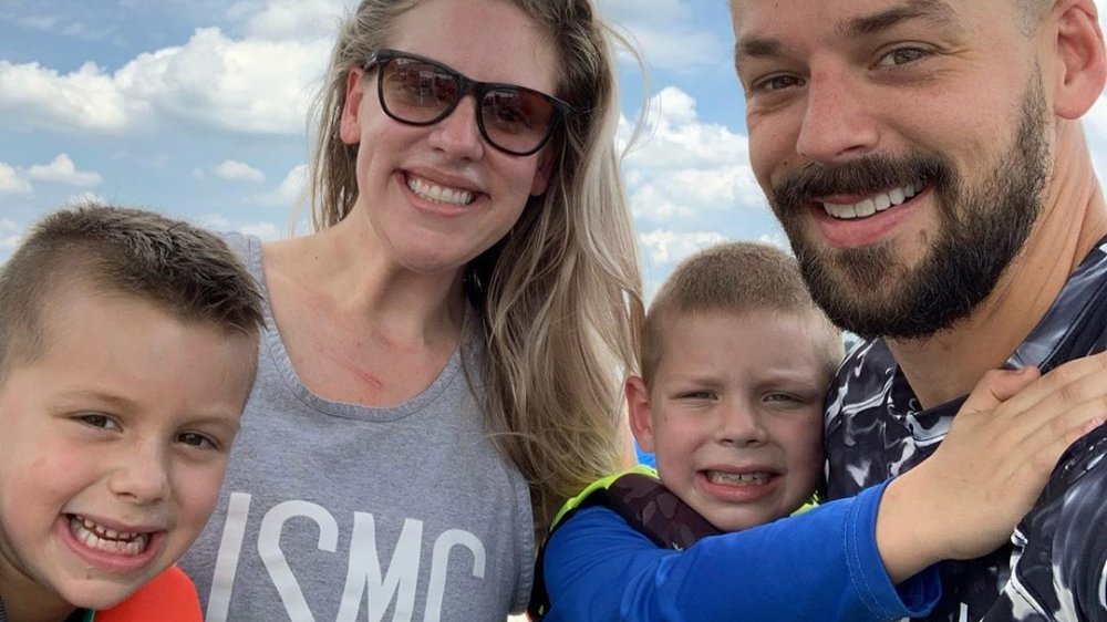 Briana Culberson posing for an Instagram selfie with her husband and two sons