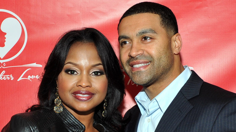 Phaedra Parks and Apollo Nida smiling and posing together