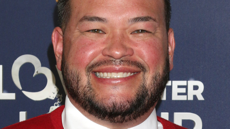 Jon Gosselin smiles in red sweater