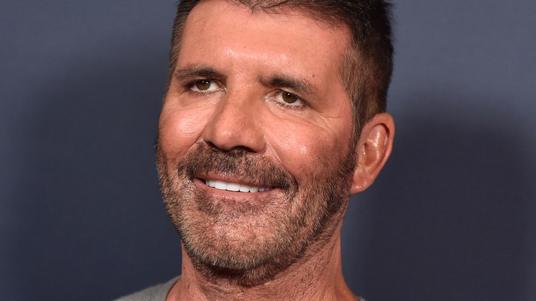 Simon Cowell smiles