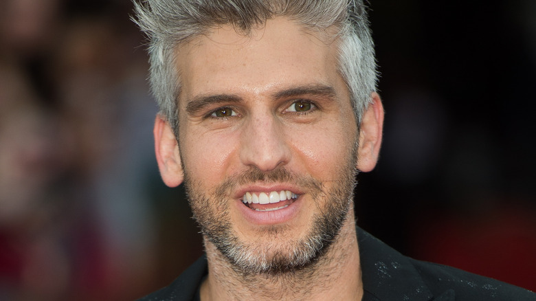 Max Joseph posing on the red carpet