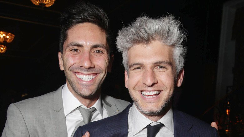 Nev Schulman and Max Joseph posing and smiling at an event