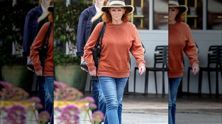 Reba shopping in Bel Air with curly hair