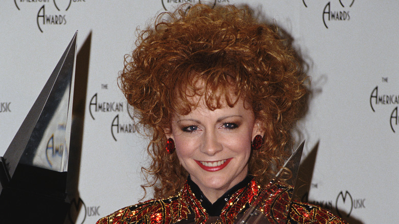 Reba McEntire with huge curly hair at the American Music Awards