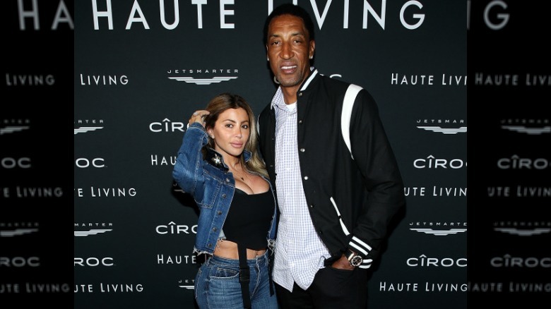 Larsa and Scottie Pippen on a red carpet, posing