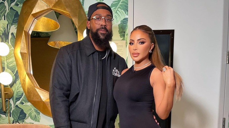 Larsa Pippen and Marcus Jordan pose together