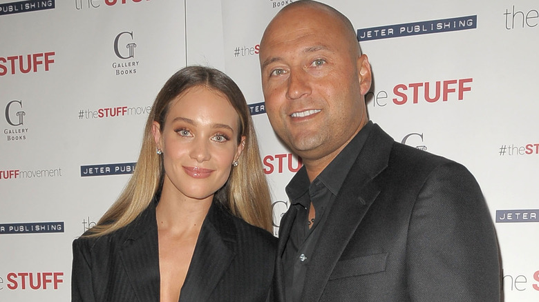 Derek and Hannah Jeter attend an event wearing dark outfits.