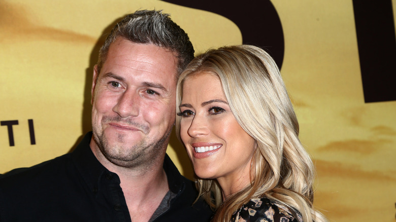 Christina Hall and Ant Anstead pose