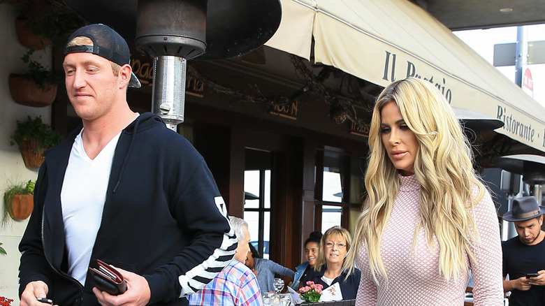 Kroy Biermann and Kim Zolciak walking 