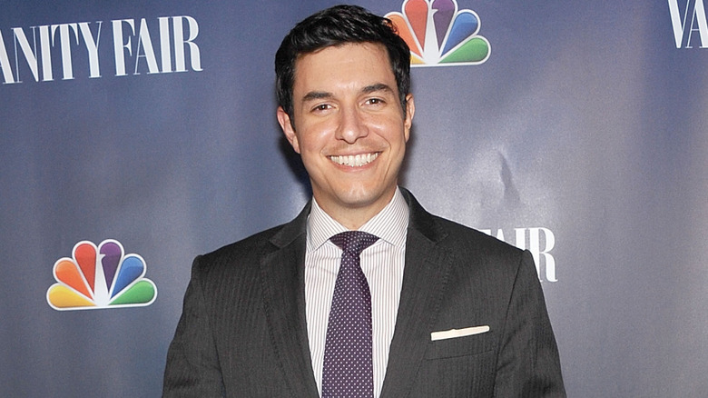 Tom Llamas wearing a gray suit at an NBC and Vanity Fair event