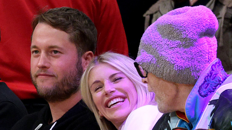 Kelly Stafford watches a game with Matthew Stafford