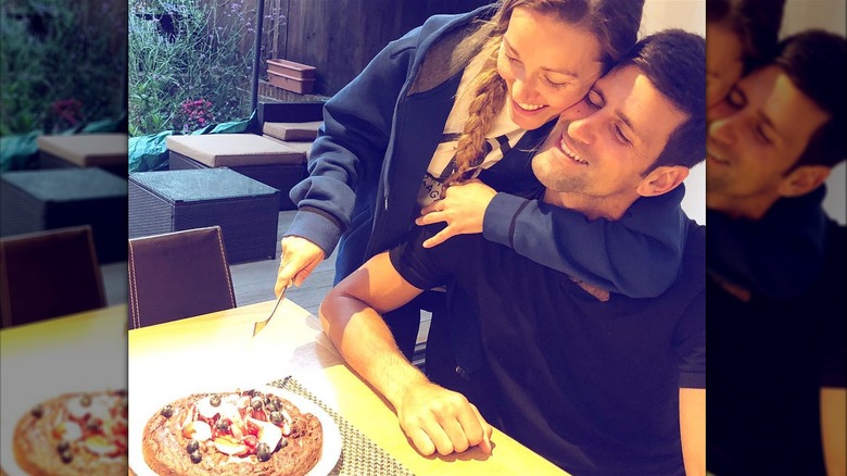 Jelena and Novak Djokovic cutting cake