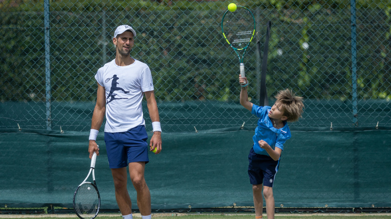 Novak and Stefan Djokovic playing tennis