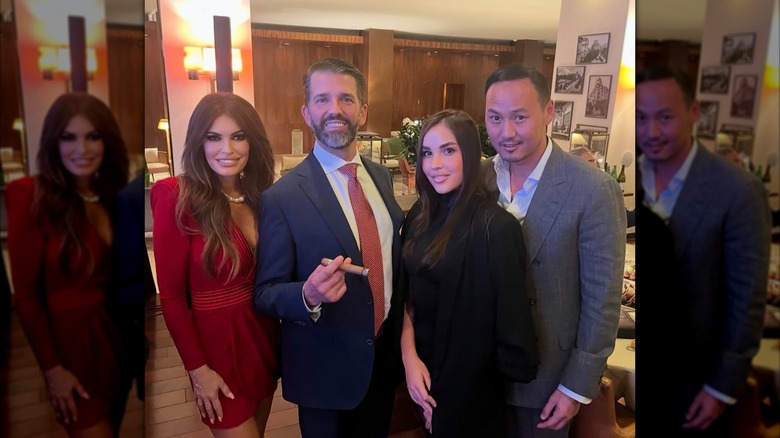 Kimberly Guilfoyle and Donald Trump Jr. posing with others on work trip abroad