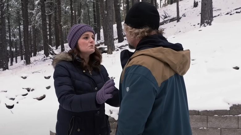 Robyn and Kody Brown speaking on a snowy hill