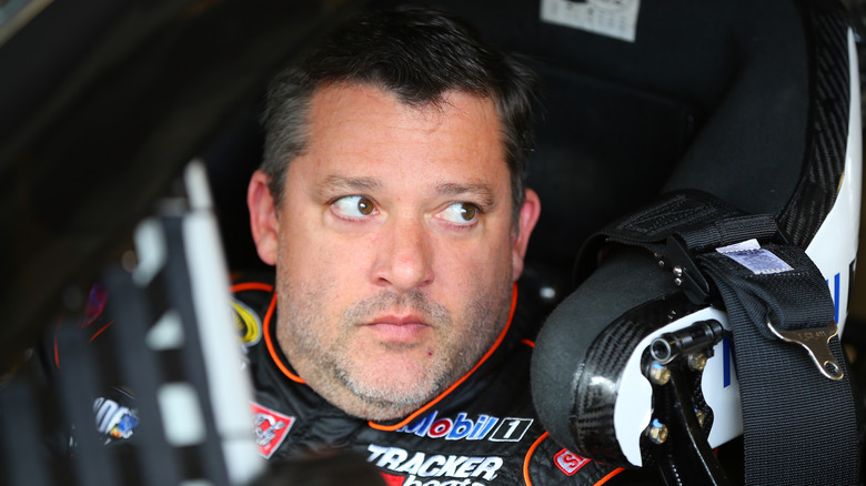 Tony Stewart sitting in a race car