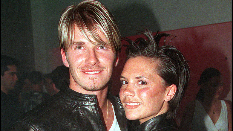 David and Victoria Beckham smiling