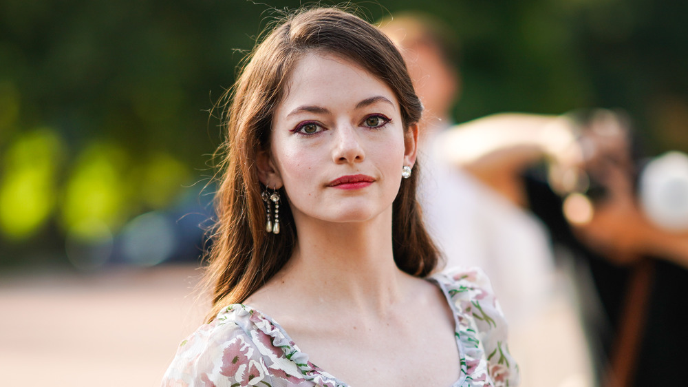 Mackenzie Foy smirking 