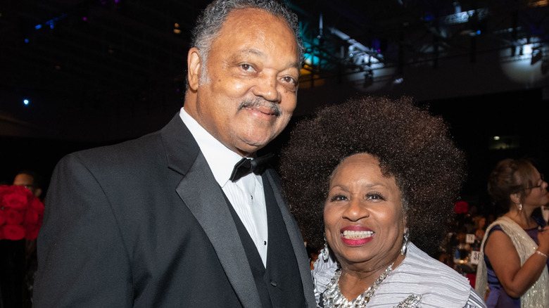 Jesse and Jacqueline Jackson smile at an event