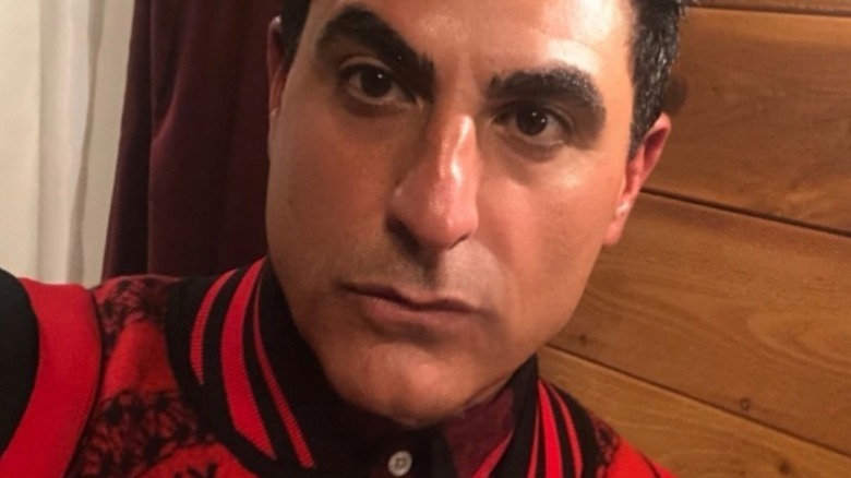 Reza Farahan looking at camera with serious expression