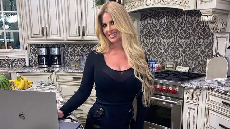 Kim Zolciak-Biermann standing in her kitchen