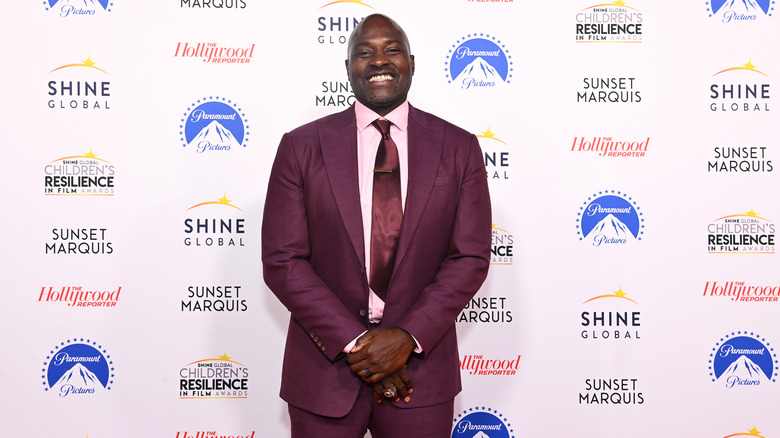 Marcellus Wiley smiling at red carpet event