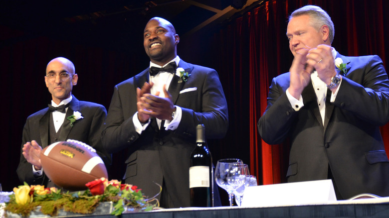 Marcellus Wiley applauding in tux