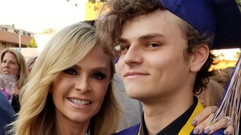 Tamra Judge smiling with Spencer Barney in a graduation cap