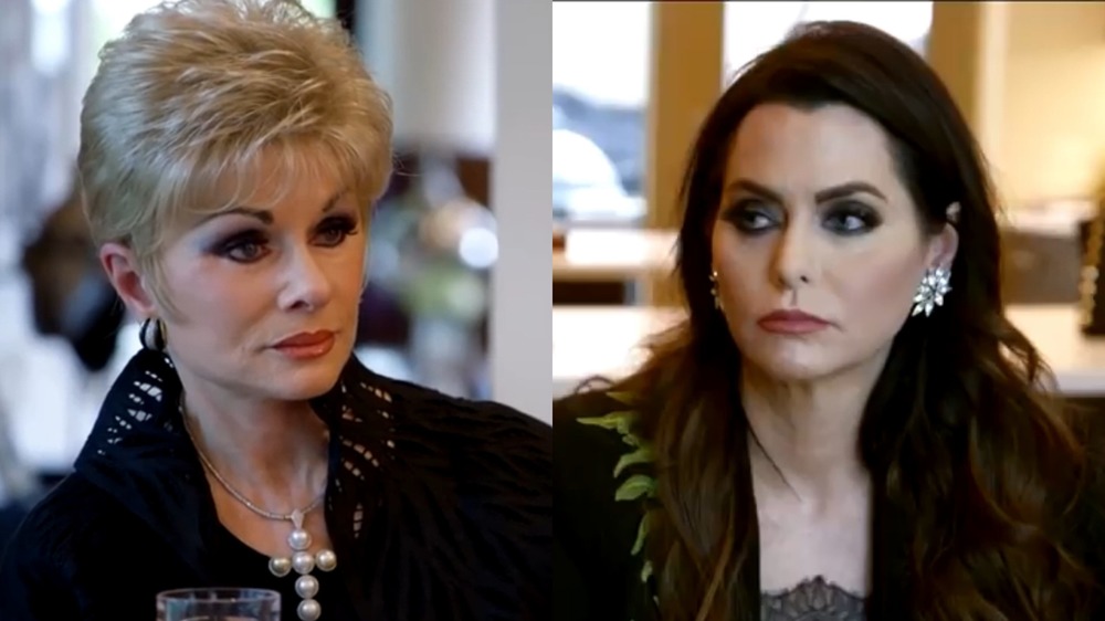 Dee Simmons and D'Andra Simmons staring at one another on RHOD