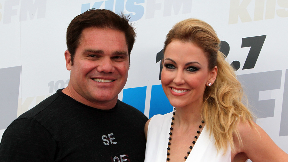 RHOD's Travis and Stephanie Hollman posing together at an event