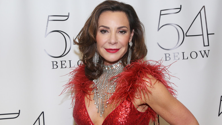 Luann de Lesseps wearing feathers