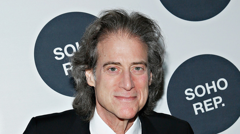 Richard Lewis smiling in close-up on red carpet 