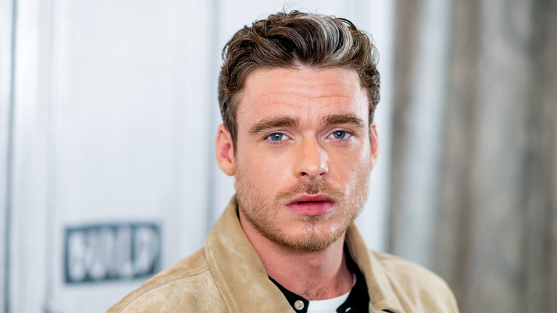 Richard Madden posing