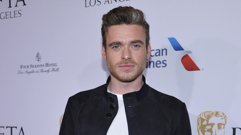 Richard Madden posing