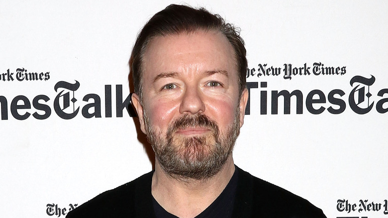 Ricky Gervais at an event, smiling