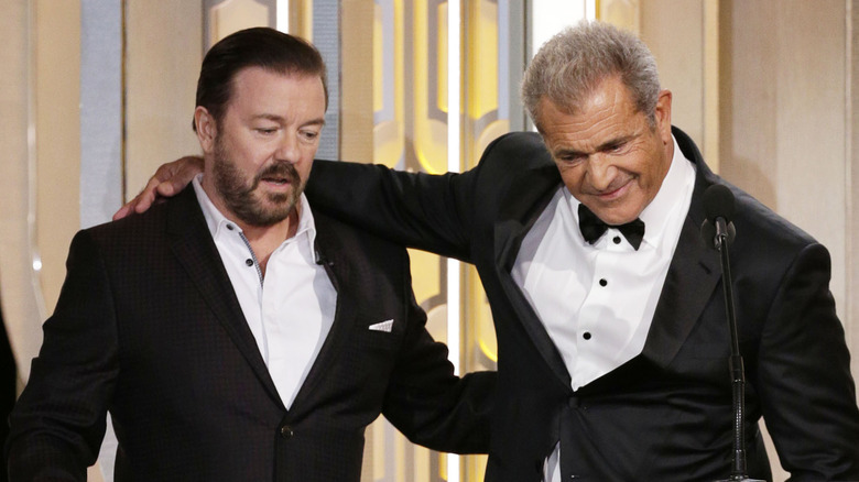 Ricky Gervais and Mel Gibson arm in arm