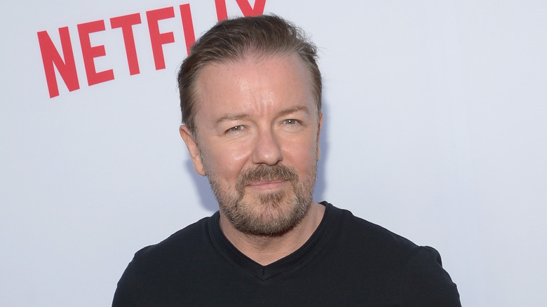 Ricky Gervais at an event, smiling