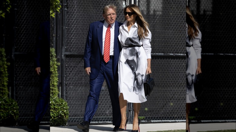 Donald Trump red tie, Melania Trump white shirt dress