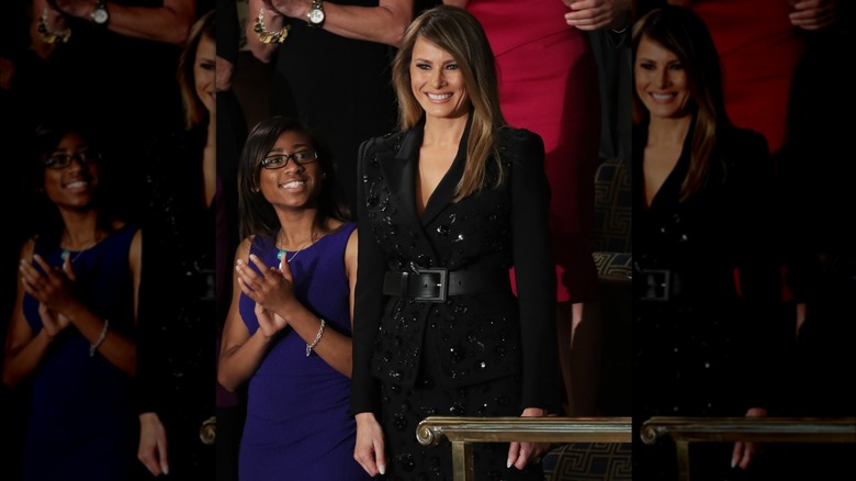 Melania Trump black suit smiling
