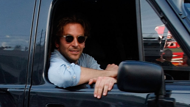 Bradley Cooper sunglasses smiling car