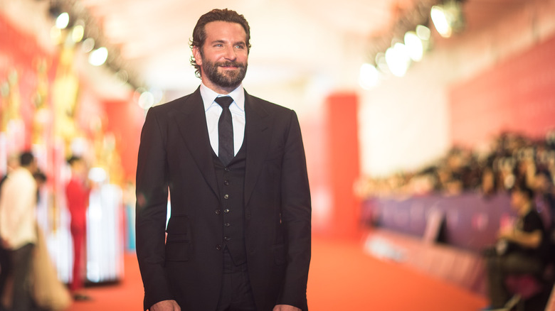 Bradley Cooper black suit beard