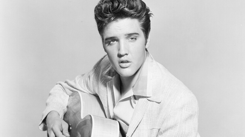 Elvis Presley posing for photo in the 1950s