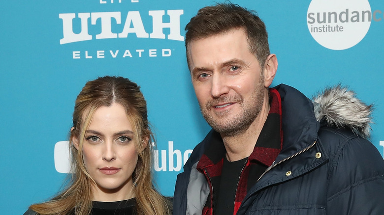 Richard Armitage and Riley Keough posing 