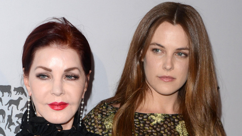 Priscilla Presley and Riley Keough looking serious