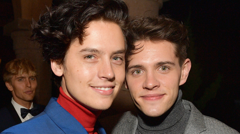 Cole Sprouse and Casey Cott posing together