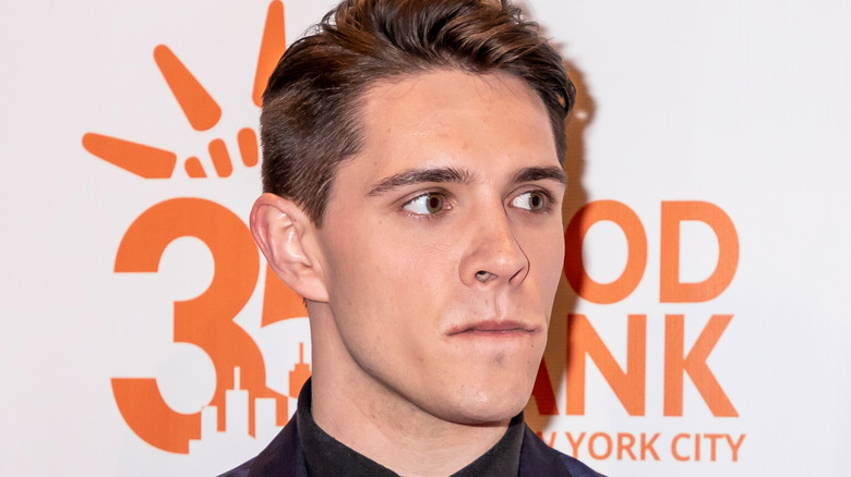 Casey Cott posing for cameras