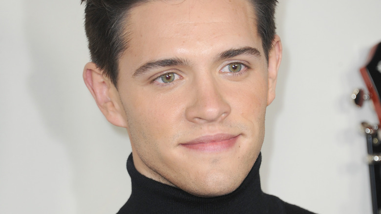 Casey Cott posing for cameras