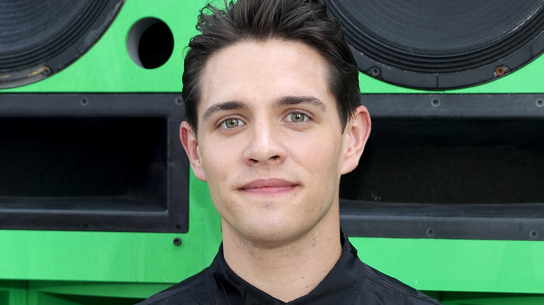 Casey Cott posing for cameras