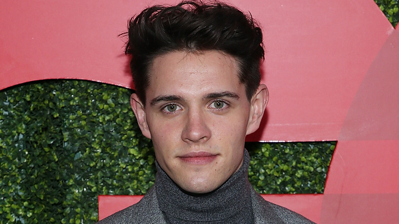 Casey Cott posing for cameras