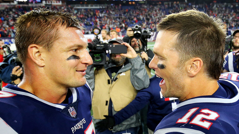 Rob Gronkowski with Tom Brady on the field